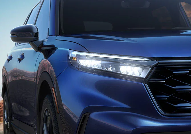 led headlights on a 2025 blue honda cr-v