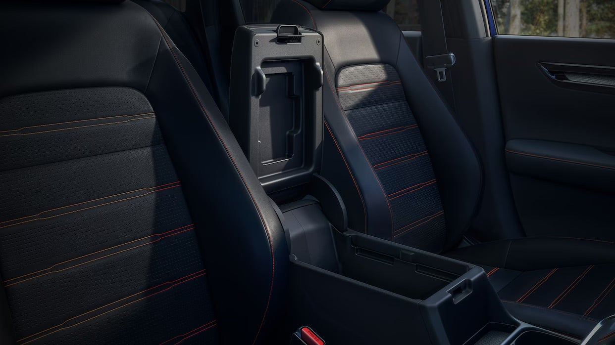 the front leather interior of a 2025 cr-v hybrid with red stitching