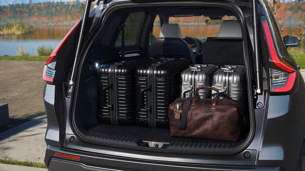Interior view of the 2025 Honda CR-V with rear seats folded, showing expansive cargo space for versatile storage.