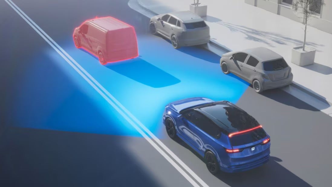 2025 honda cr-v hybrid showcasing safety features while driving