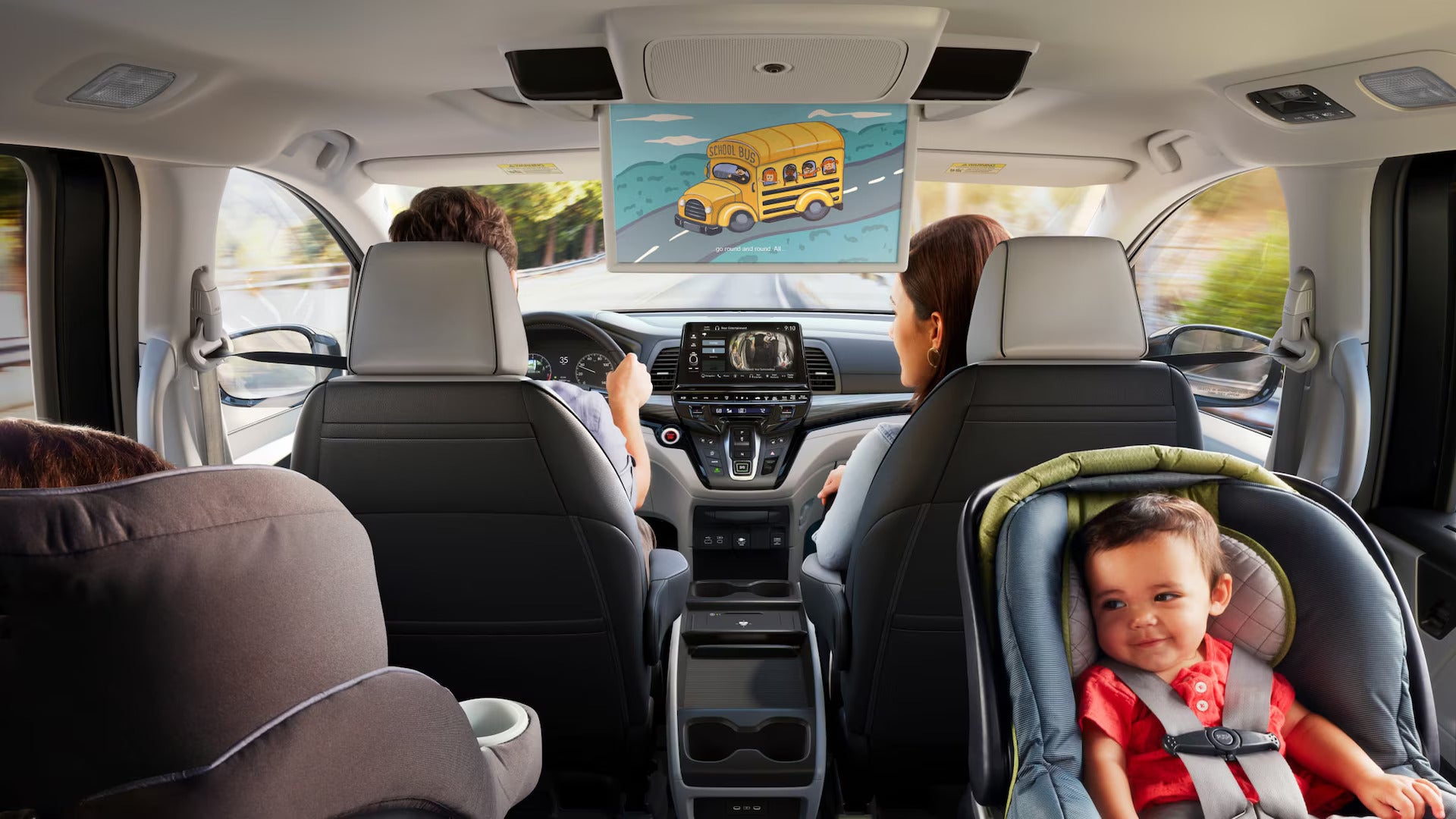 A family riding in a van.