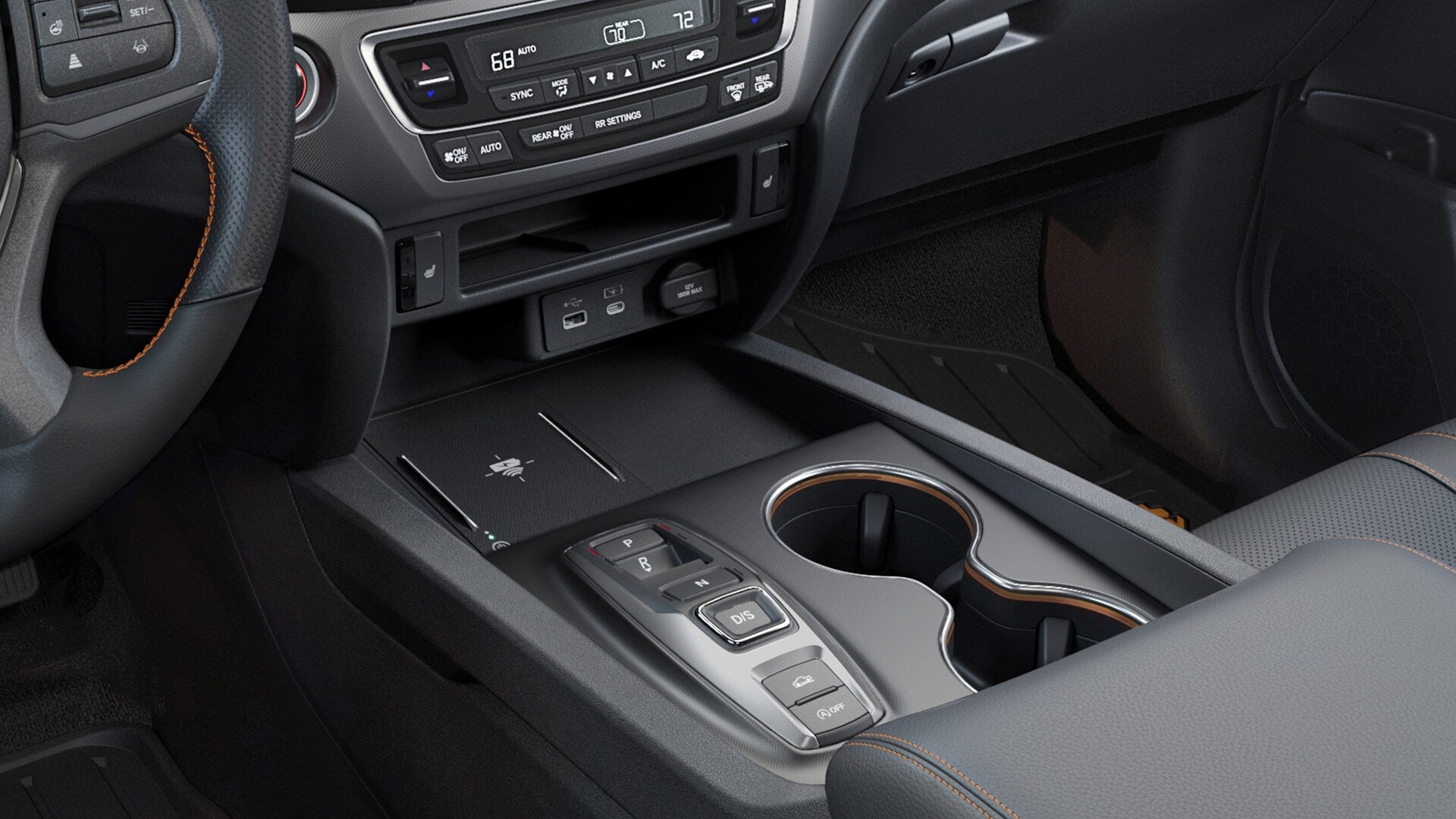 2025 Honda Ridgeline TrailSport in Black interior, wireless phone chargind detail.