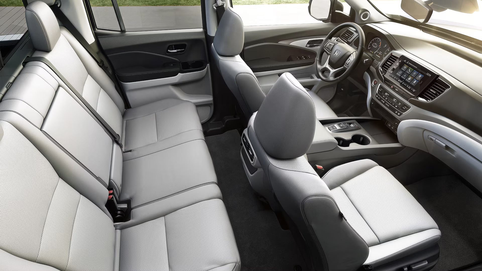 2025 Honda Ridgeline RTL with gray leather interior, showing rear and front seats.