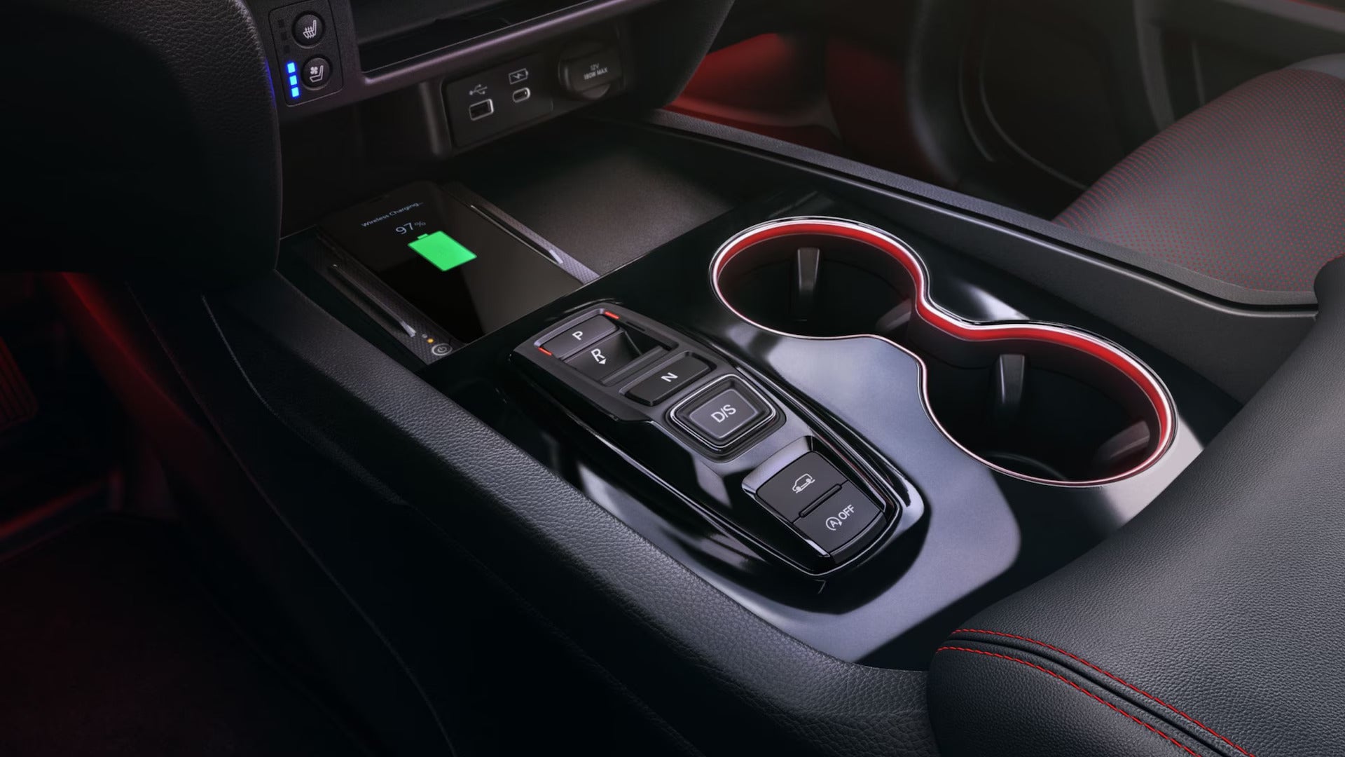 cargo space in the front interior with wireless charging and cupholders