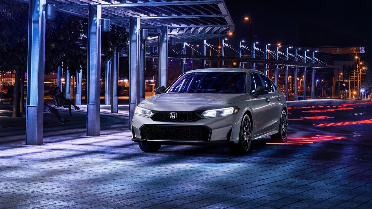 Front view of the 2025 Honda Civic LX Sedan in red.