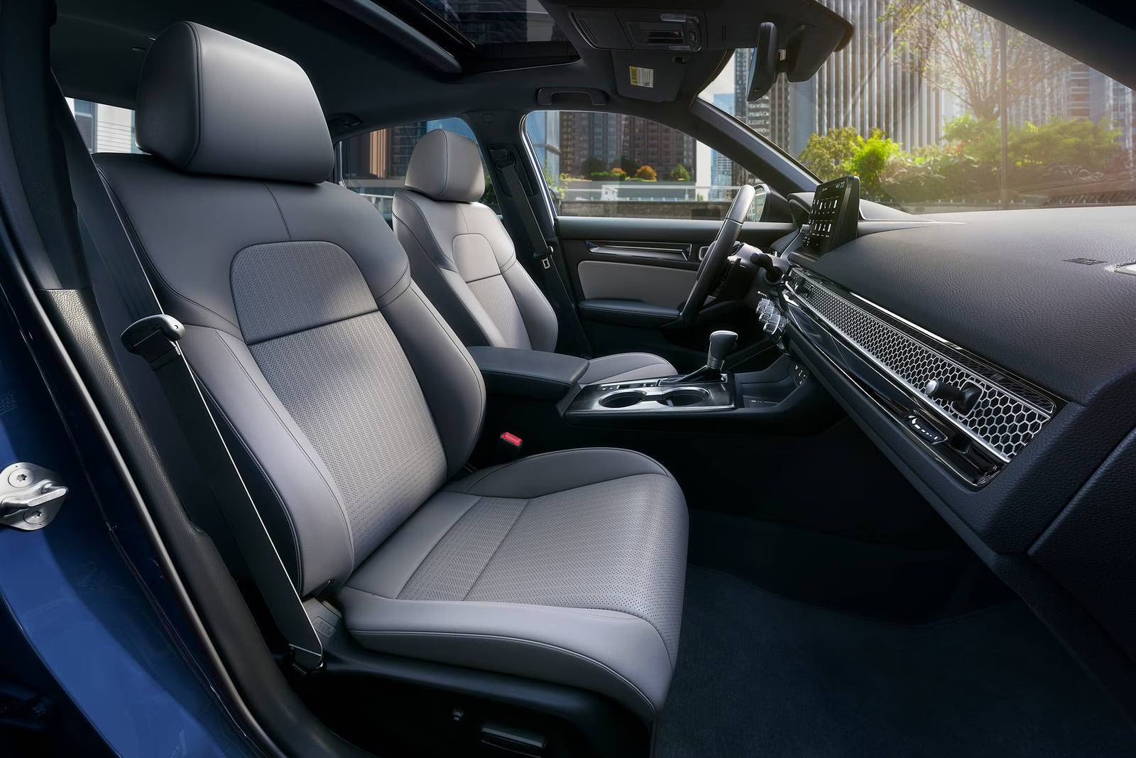 The interior of a honda civic sedan.