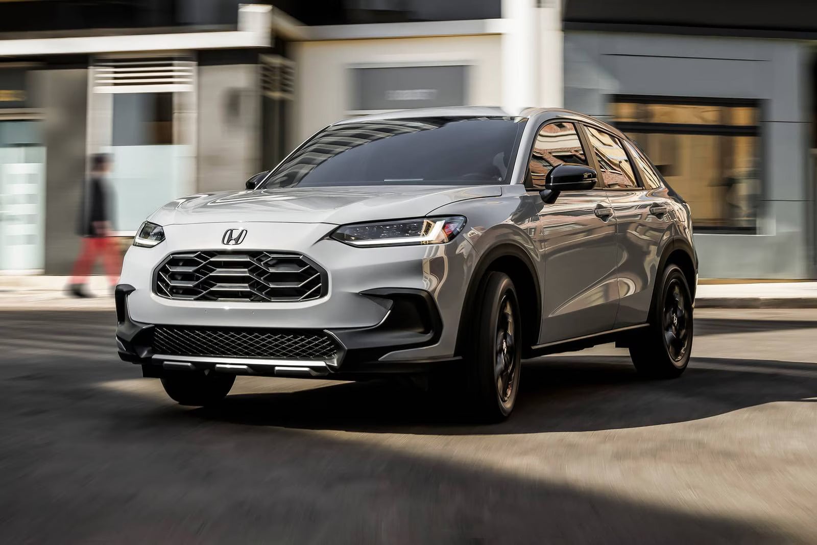 A gray hr-v driving on the road.