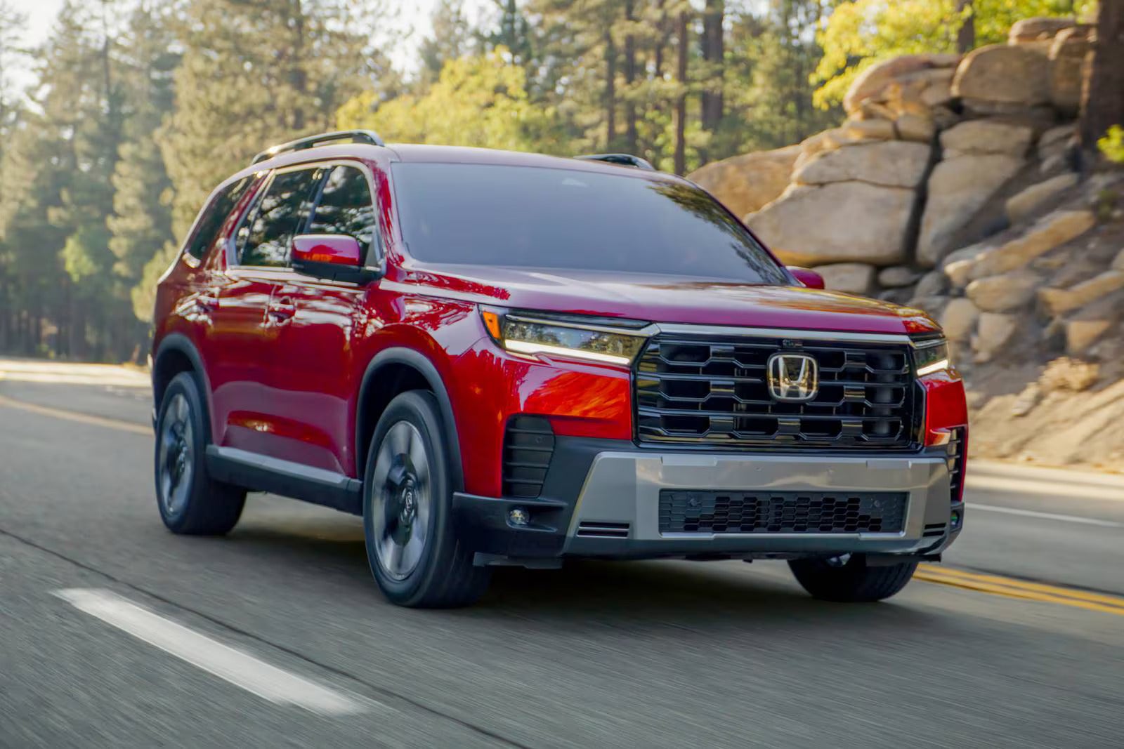 A red pilot driving on the road.