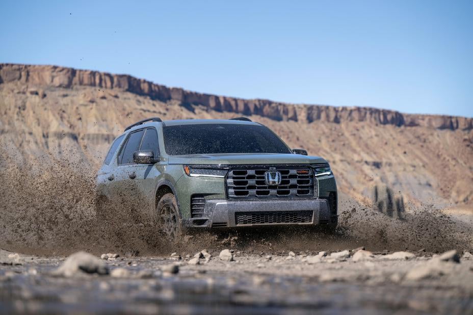 A green pilot driving off-road.