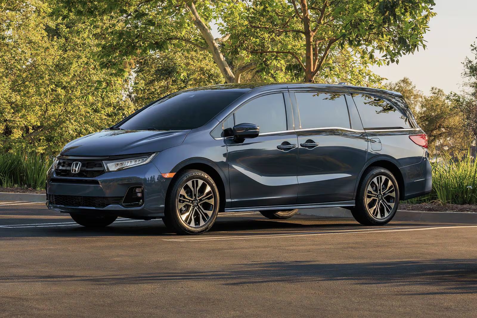 A gray van sitting parked.