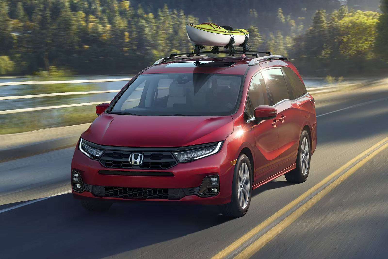 A red van driving on the road.