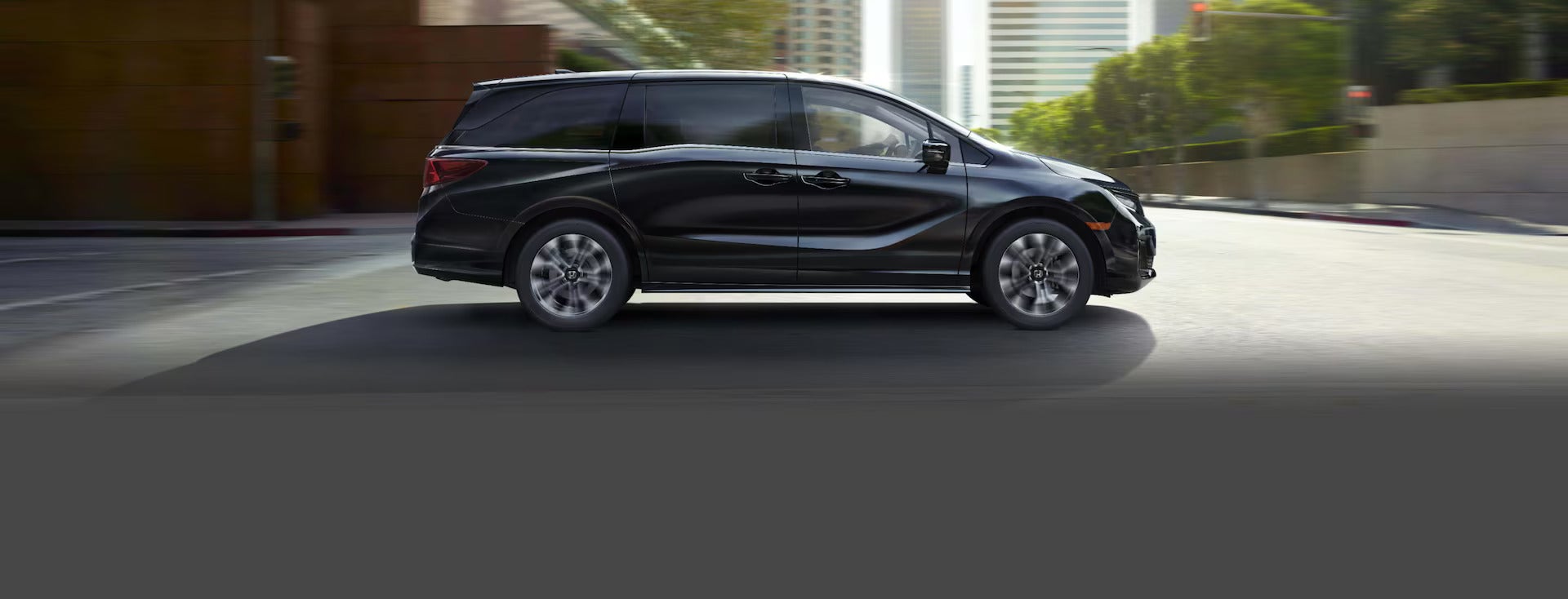 A black van driving on the road.