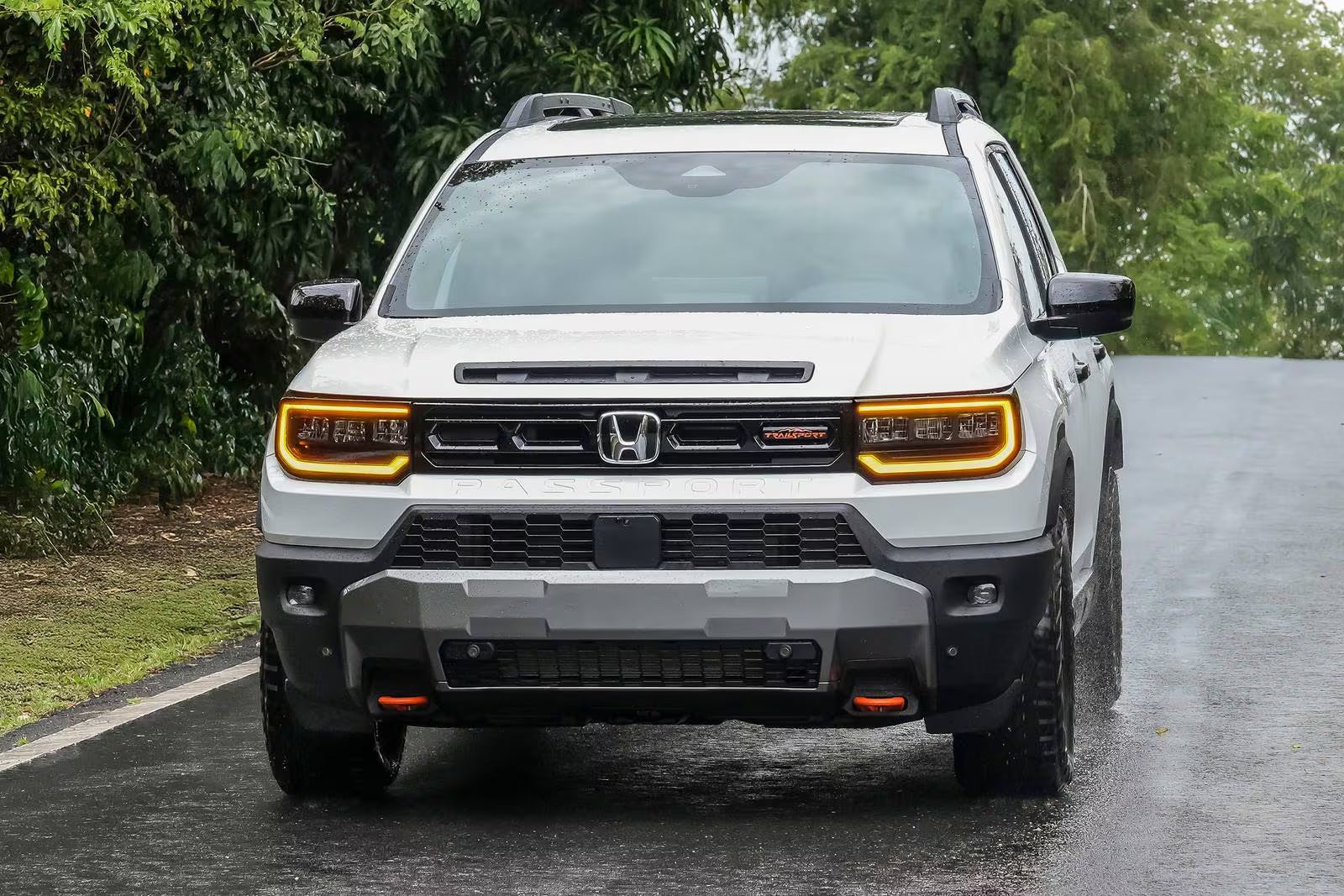 A gray passport driving on the road.