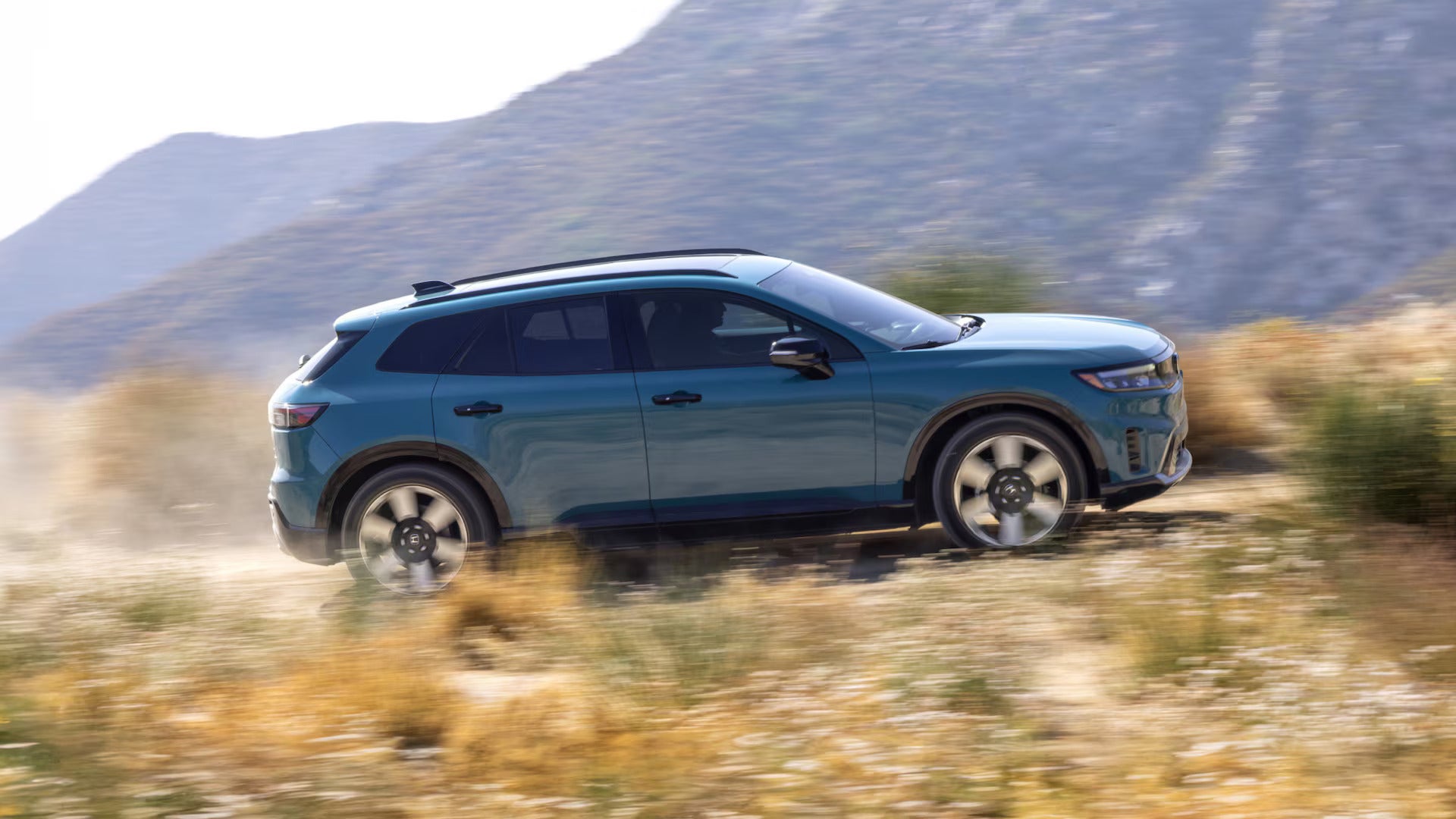 2026 Honda Prologue driving up a mountain