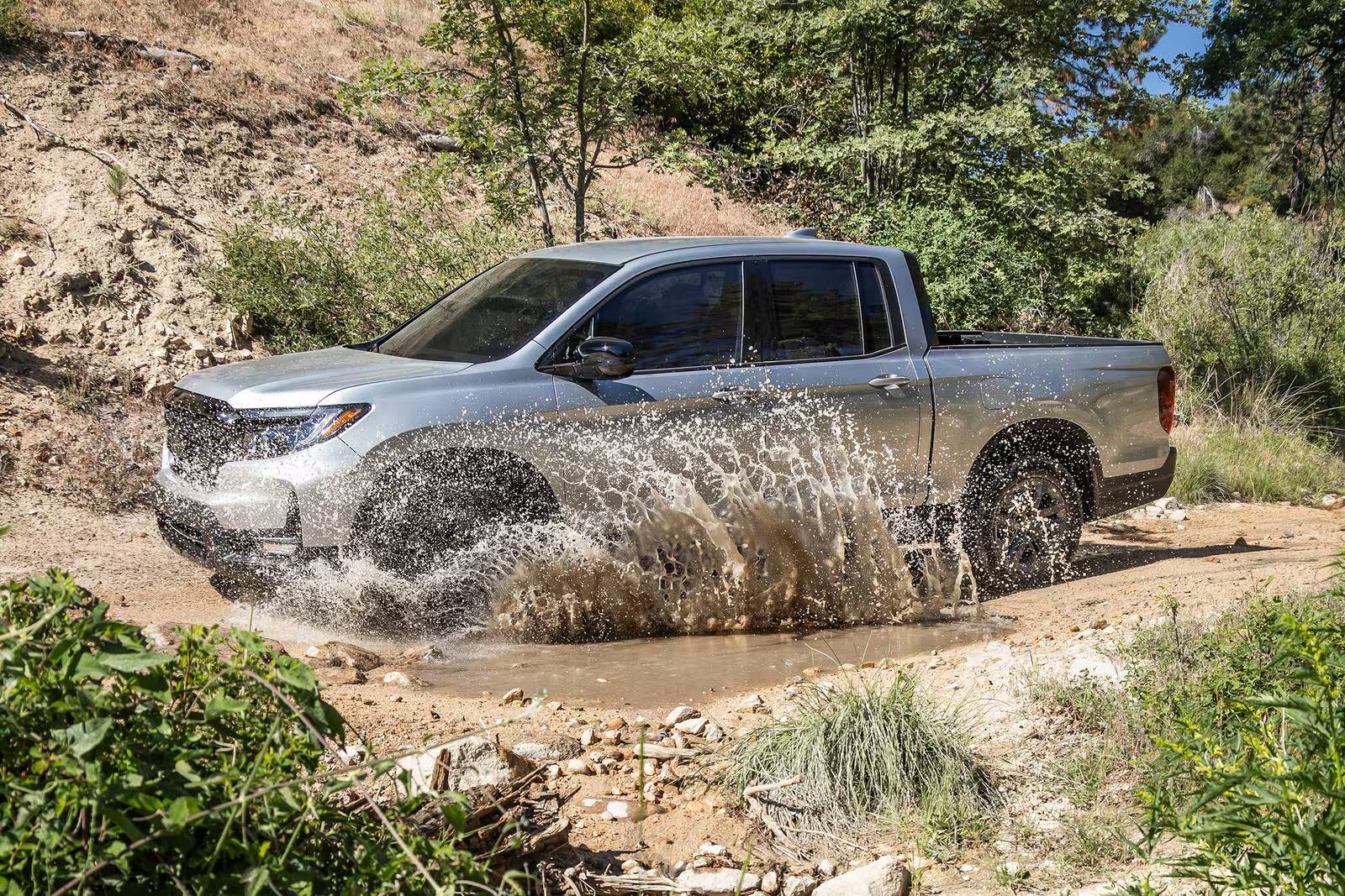 A truck driving through water.