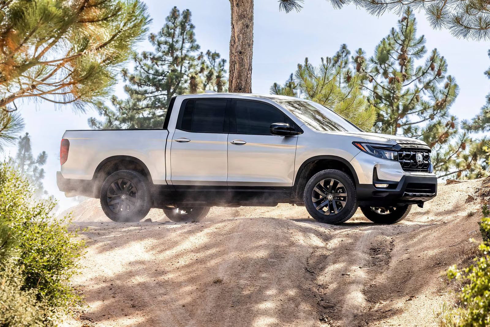 A gray truck sitting parked.