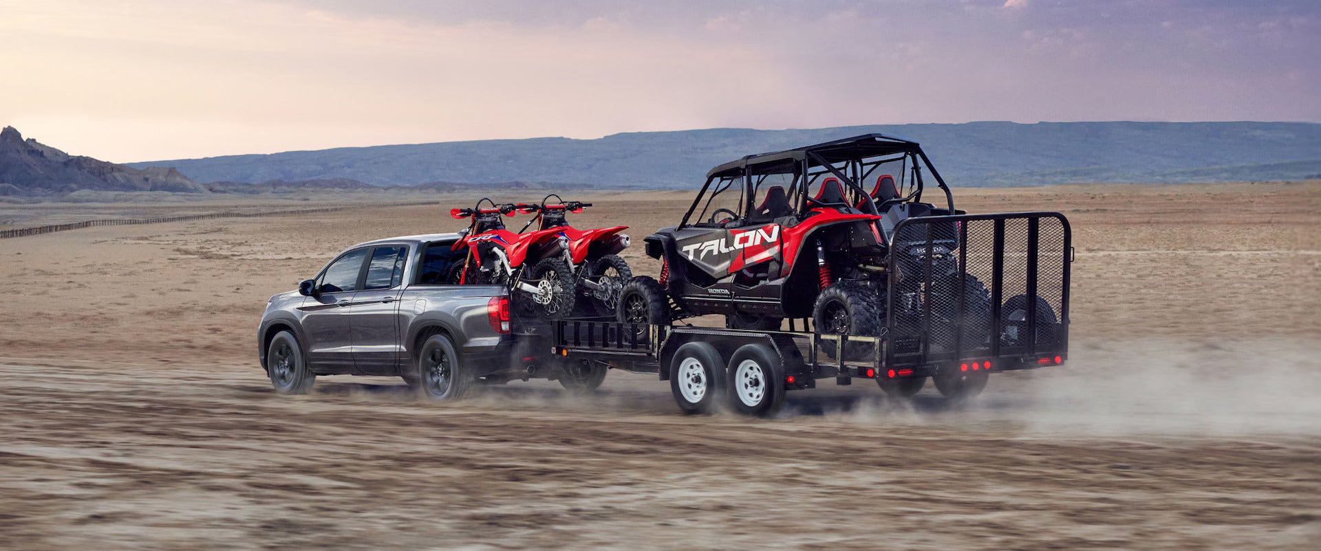 A ridgeline pulling a full trailer.