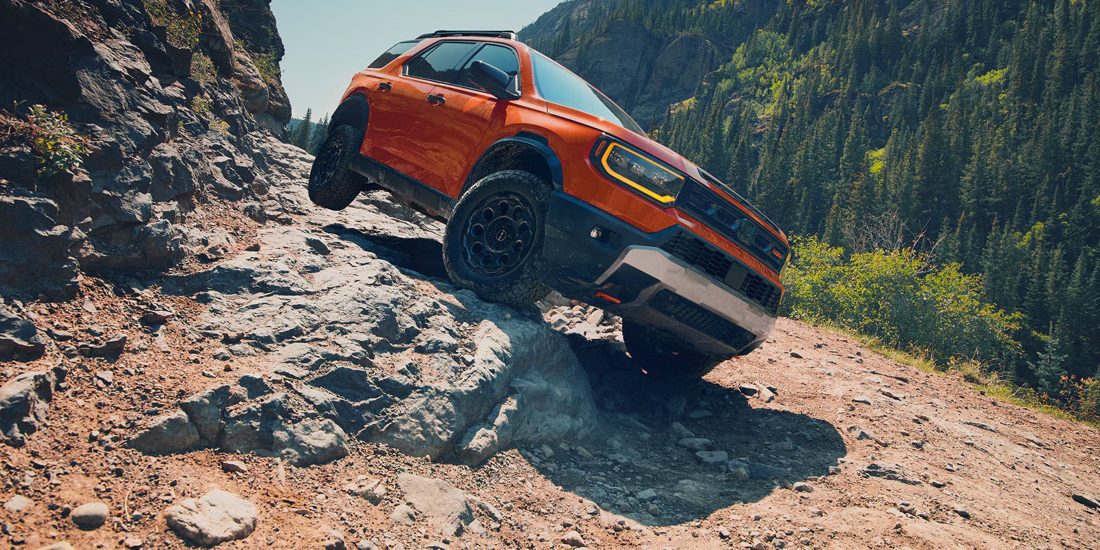 2027 Honda Passport TrailSport driving on rugged terrain