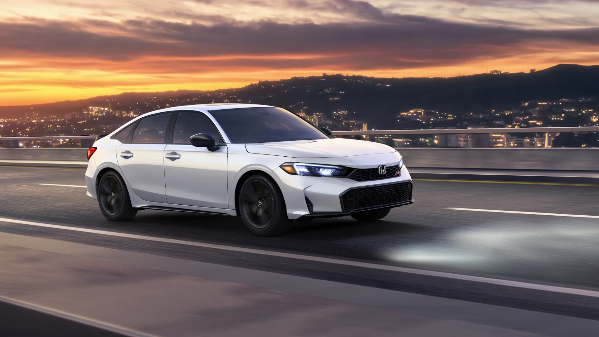 A white car driving on the road.